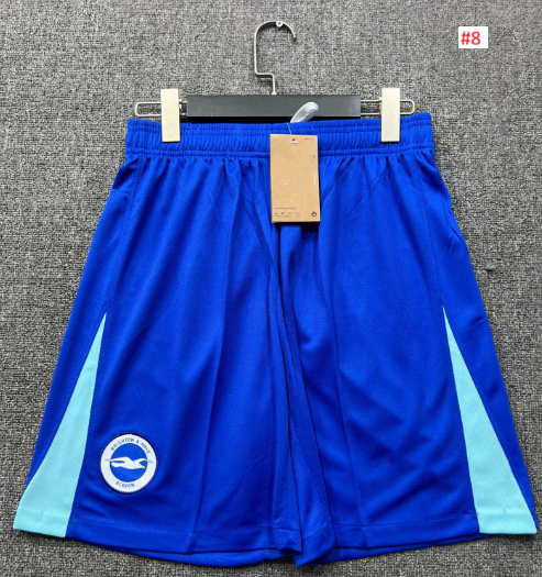 מכנסי כדורגל כחולים עם פנלים תכלת וסמל עגול