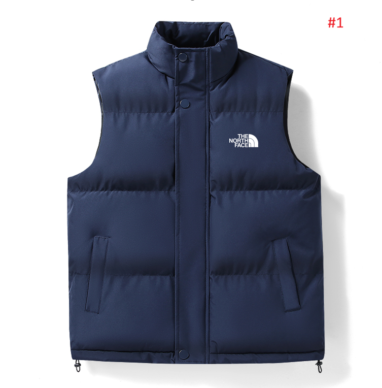וסט מרופד The North Face בצבע כחול כהה עם סגירת תיקתקים מלפנים