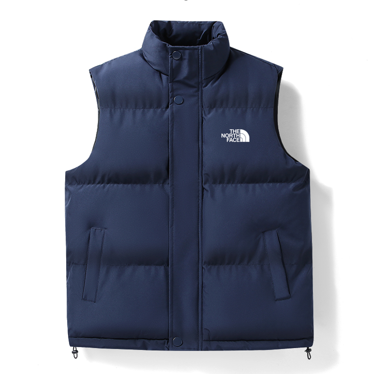The North Face וסט מרופד חורפי עם צווארון עומד וסט מרופד The North Face לשכבות בחורף, חזית בצבע כחול כהה